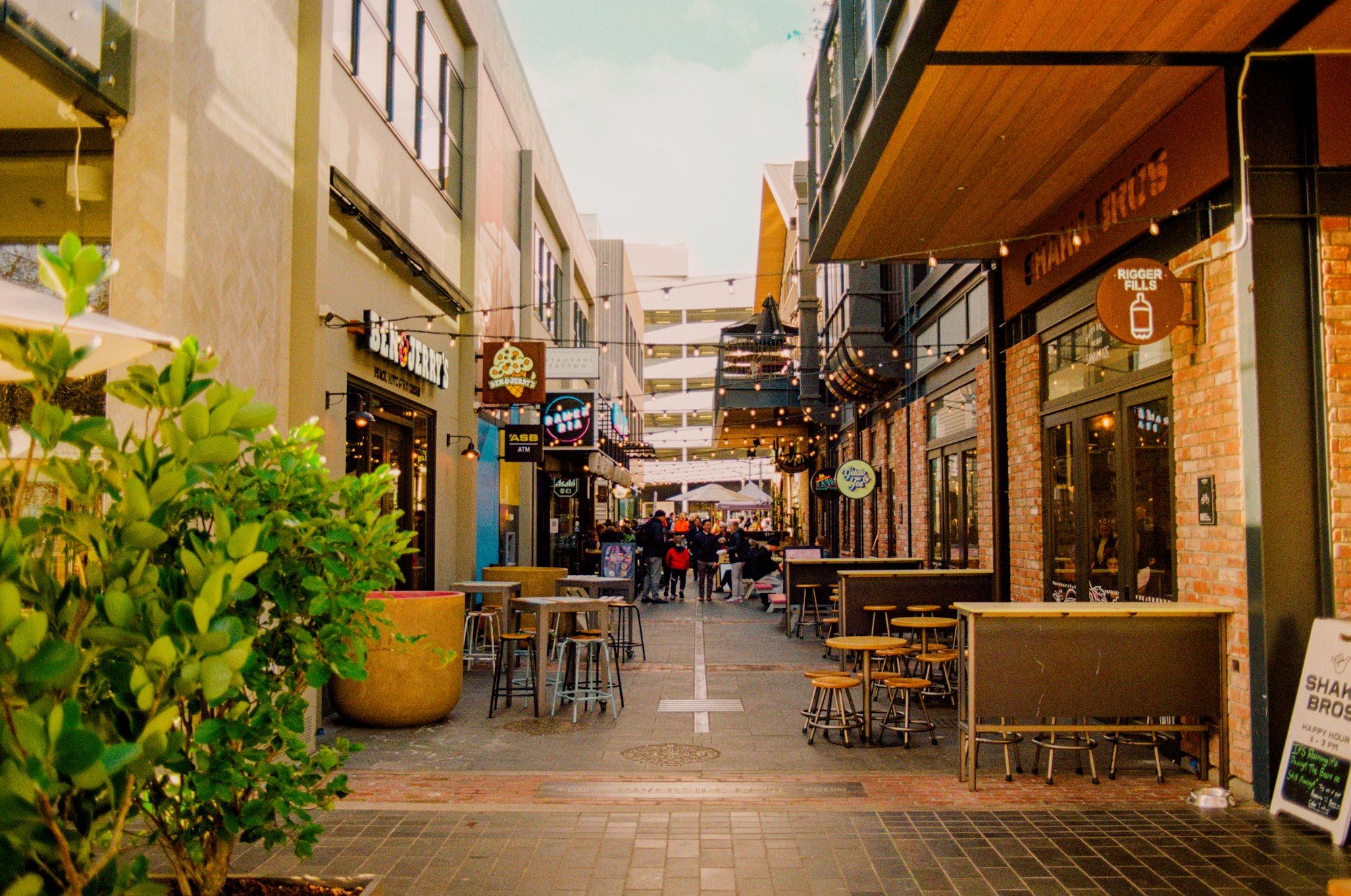 Outdoor tables and chairs along the street outside Riverside Market on Oxford Terrace, Christchurch