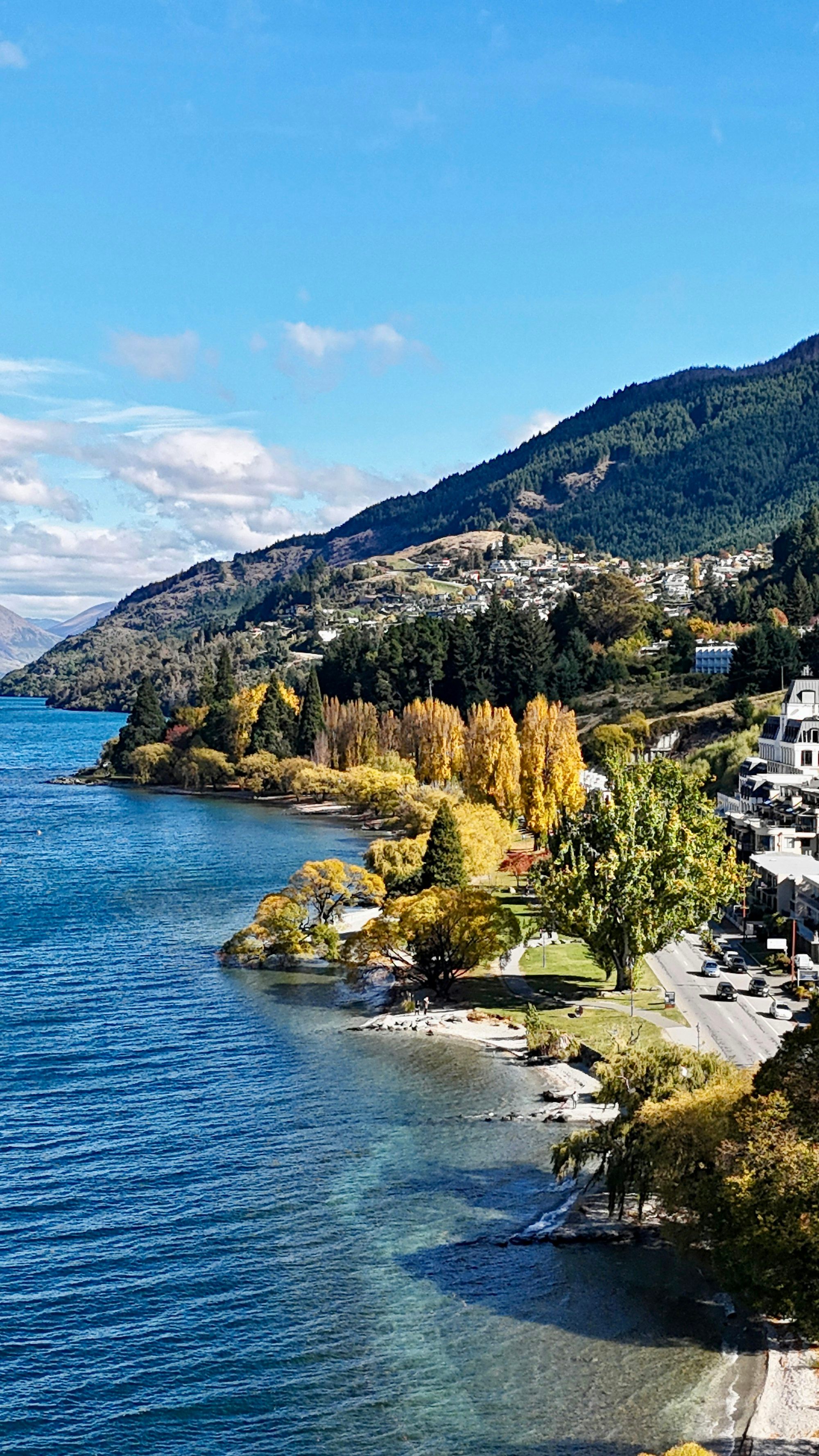 Queenstown town beside Lake Wakatipu, framed by the surrounding mountains